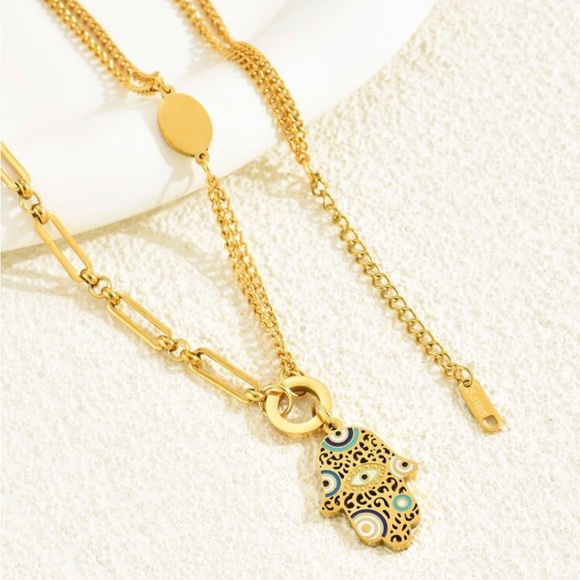 Jewelry - Gold tone hamsa necklace.